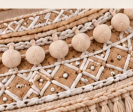 Close view of geometric embroidered trim on the AI collar concept